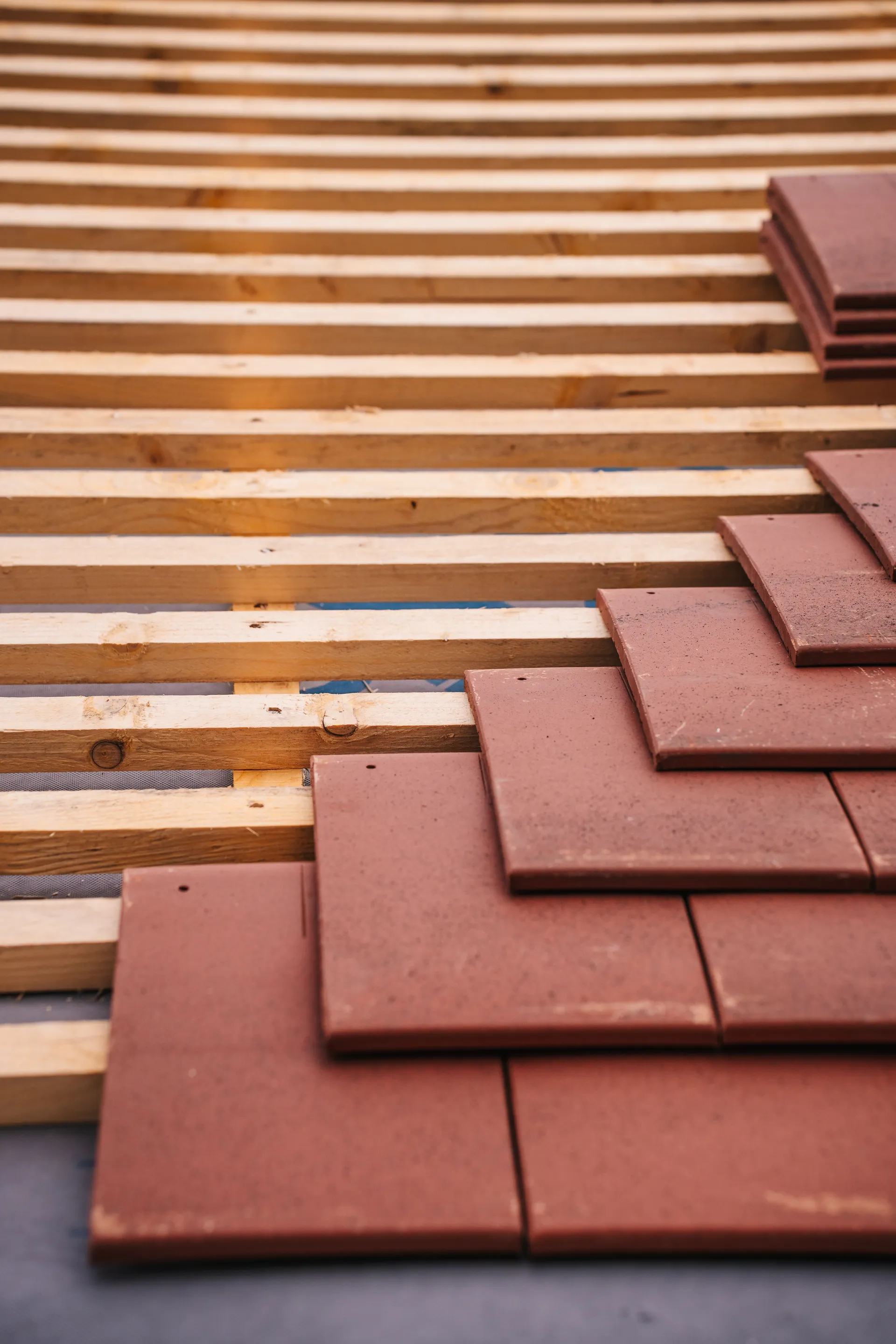 Professional roofing crew installing shingles